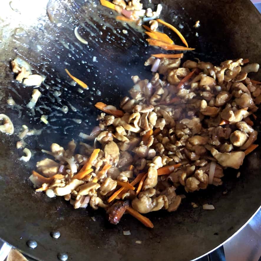 chicken and vegetable stir-frying in the wok
