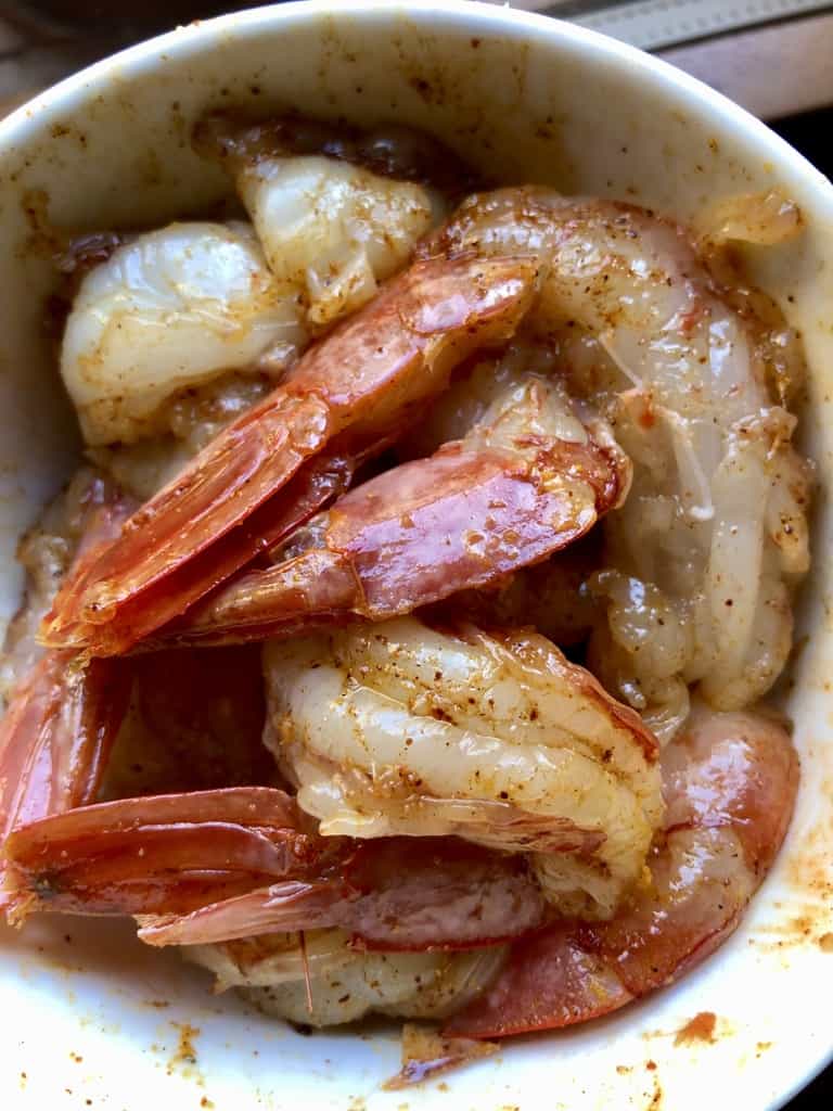 argentinian red shrimp marinating in extra virgin olive oil and a spice rub made from smoked paprika, sweet paprika, and onion powder