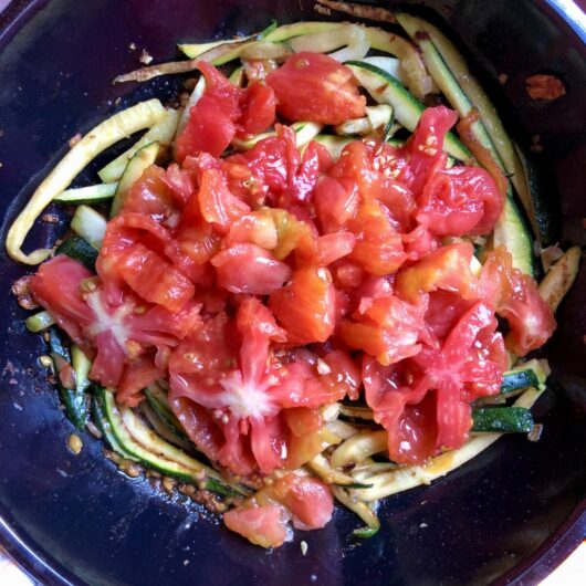 fresh chopped and skinless tomatoes added to the sauteed zucchini