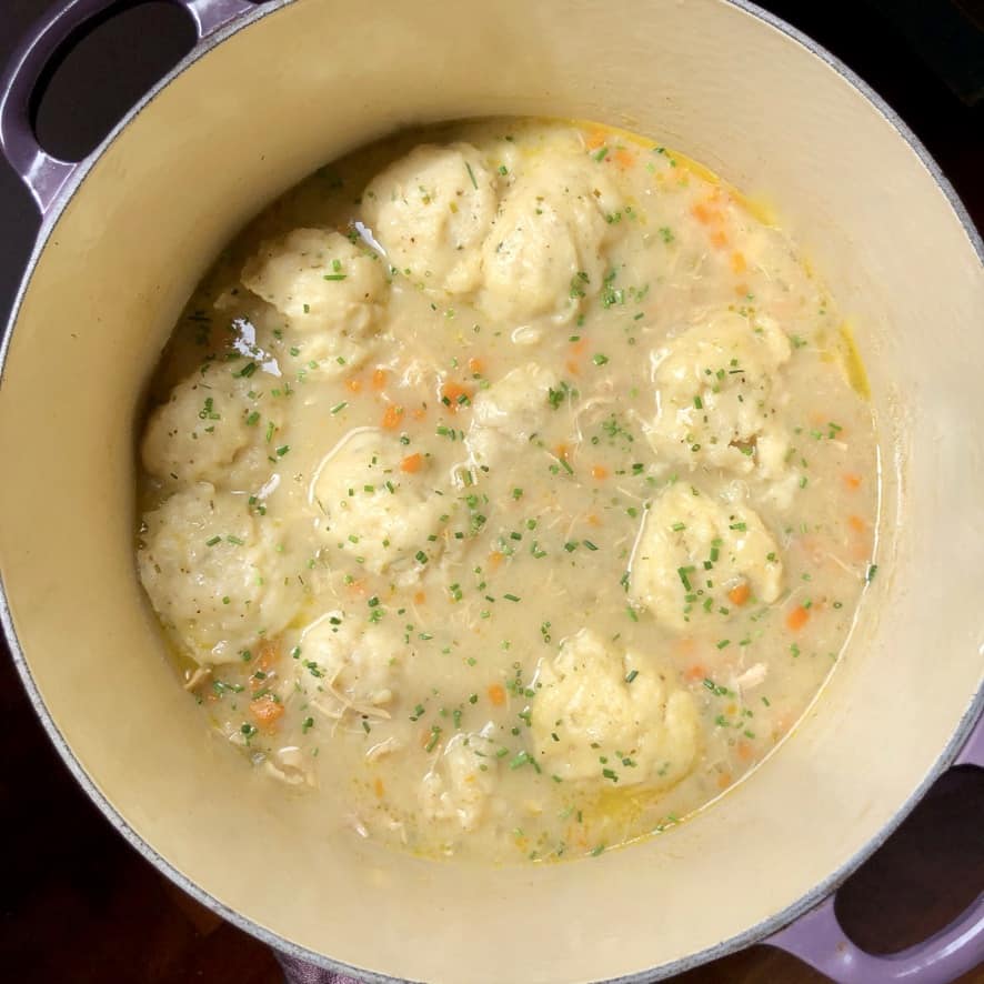 pot full of the best homemade fluffy chicken and dumplings