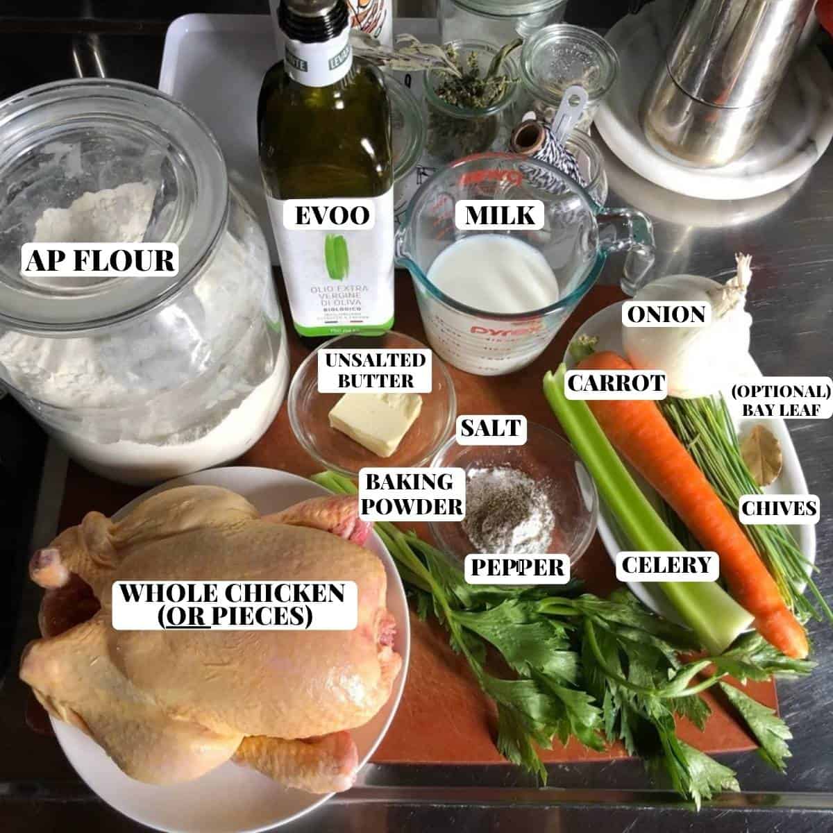 Labeled chicken and dumpling soup ingredients on a cutting board.