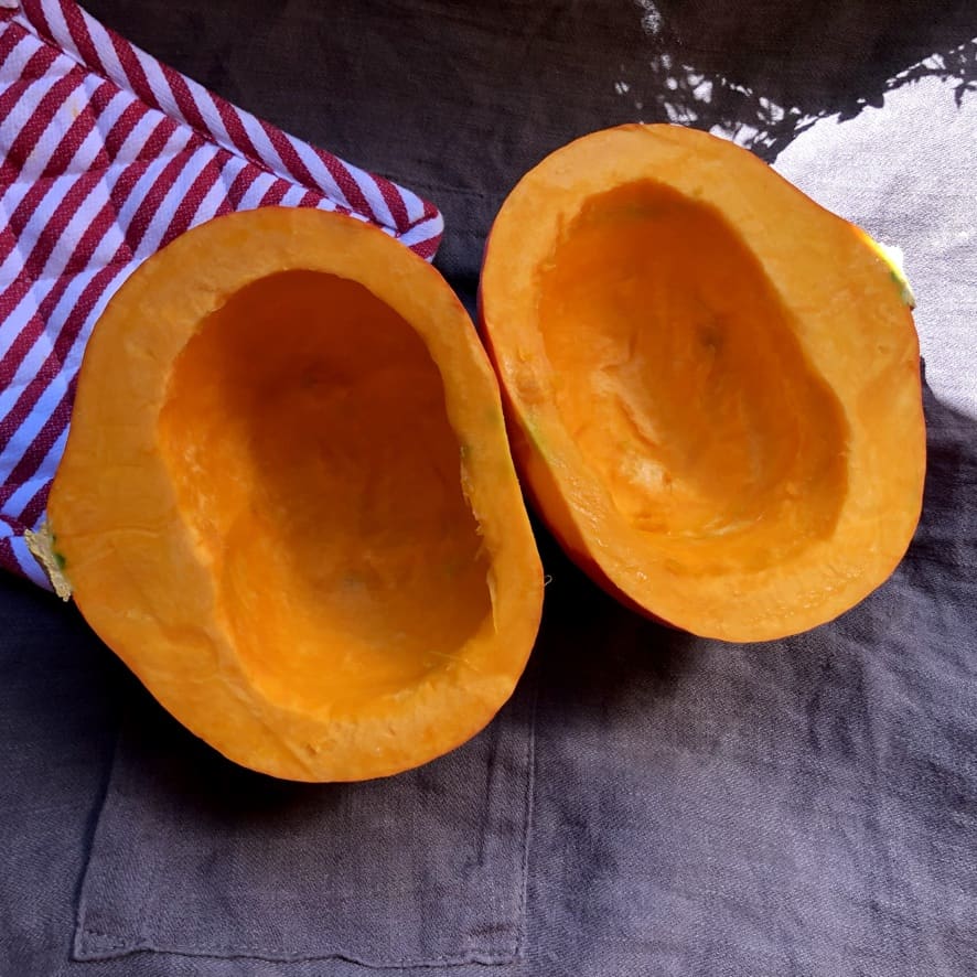 two halves of a hakkaido pumkin with the seeds and skin removed