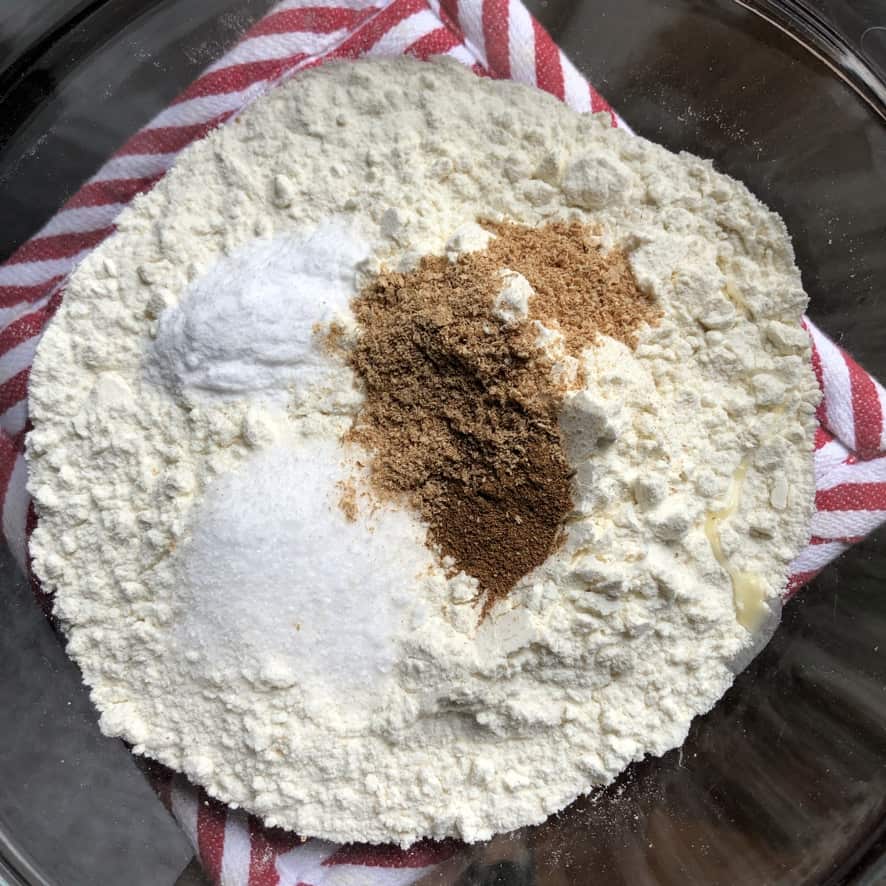 Pumpkin muffin dry ingredients in a bowl before being sifted.