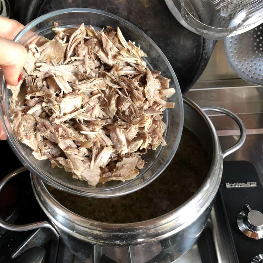 adding diced turkey meat to the soup