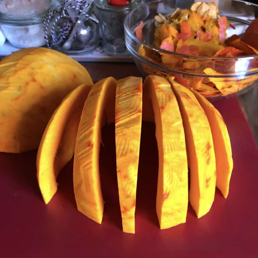 half of a pumpkin cut into wedges and standing upright looking like a dome