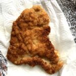 large golden brown turkey breast cutlet with panko bread crumbs