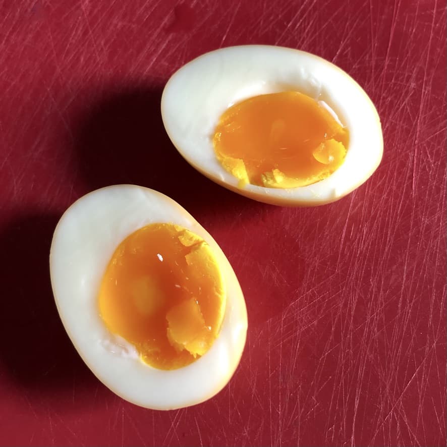 jammy soft boiled eggs cut in half