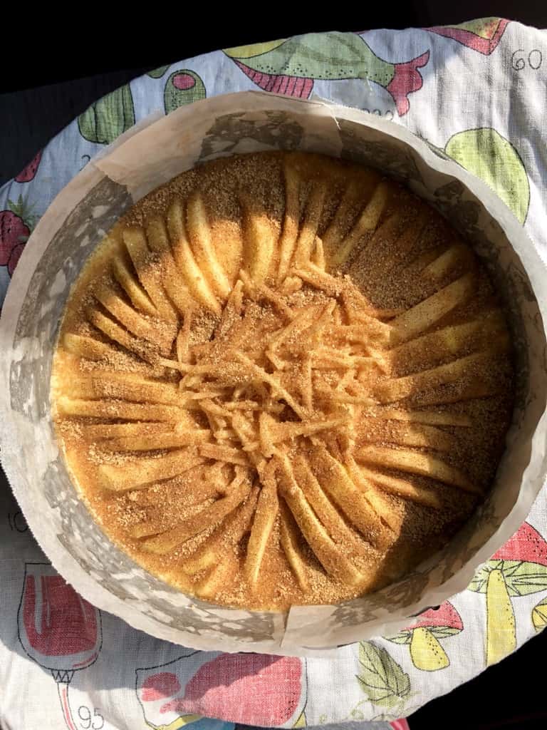unbaked apple cake with spices and sugar mixture covering the entire top
