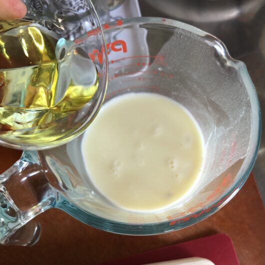 adding the oil and vanilla to the milk