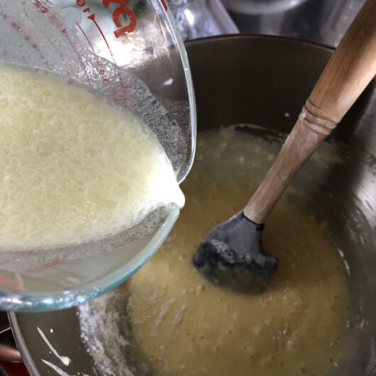 adding 1/3 of milk mixture to the batter