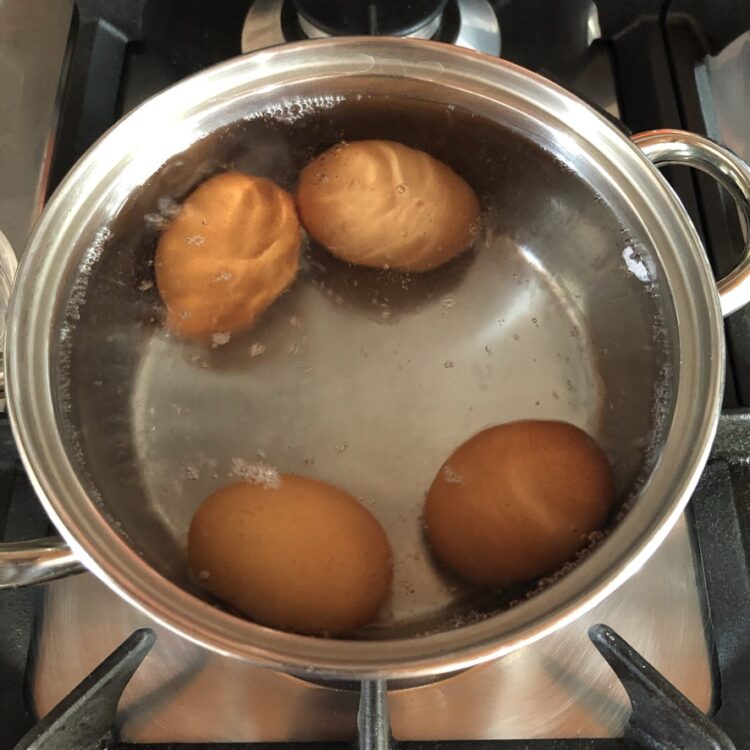 soft boiling eggs in a hot water