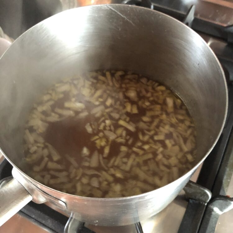 bringing the soup base to a boil
