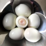 a bowl full of soft boiled eggs for ramen