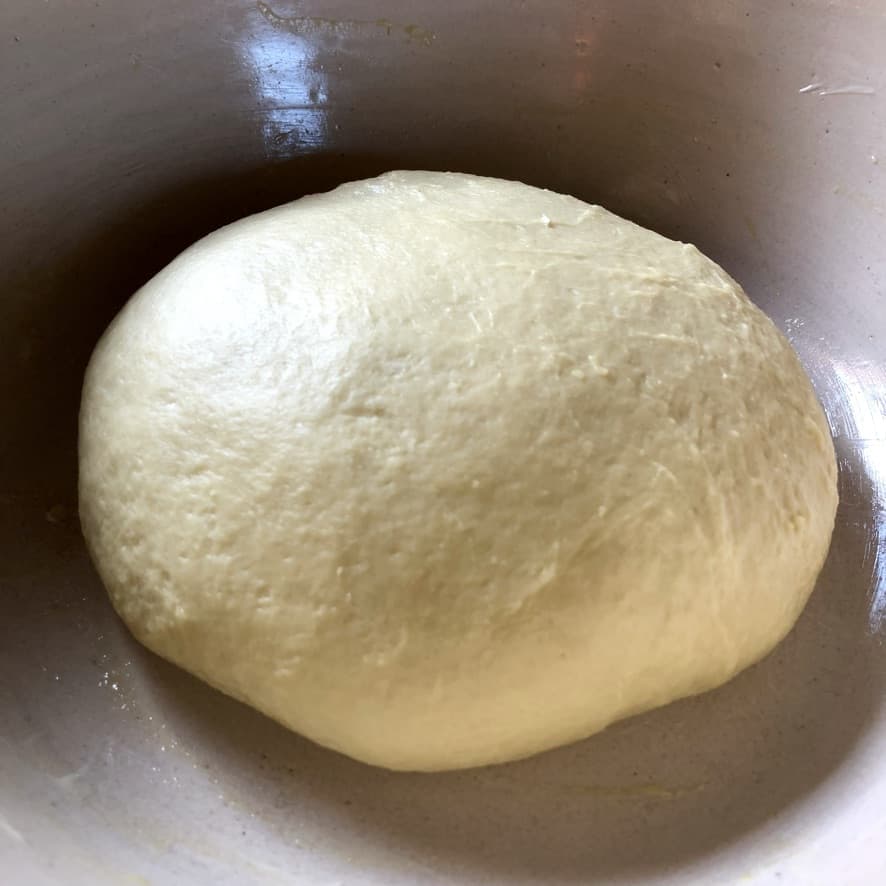 closeup cinnamon roll dough after about to be covered and allowed to rise