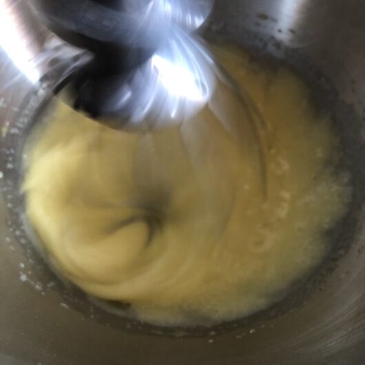 whisking eggs and sugar until pale yellow