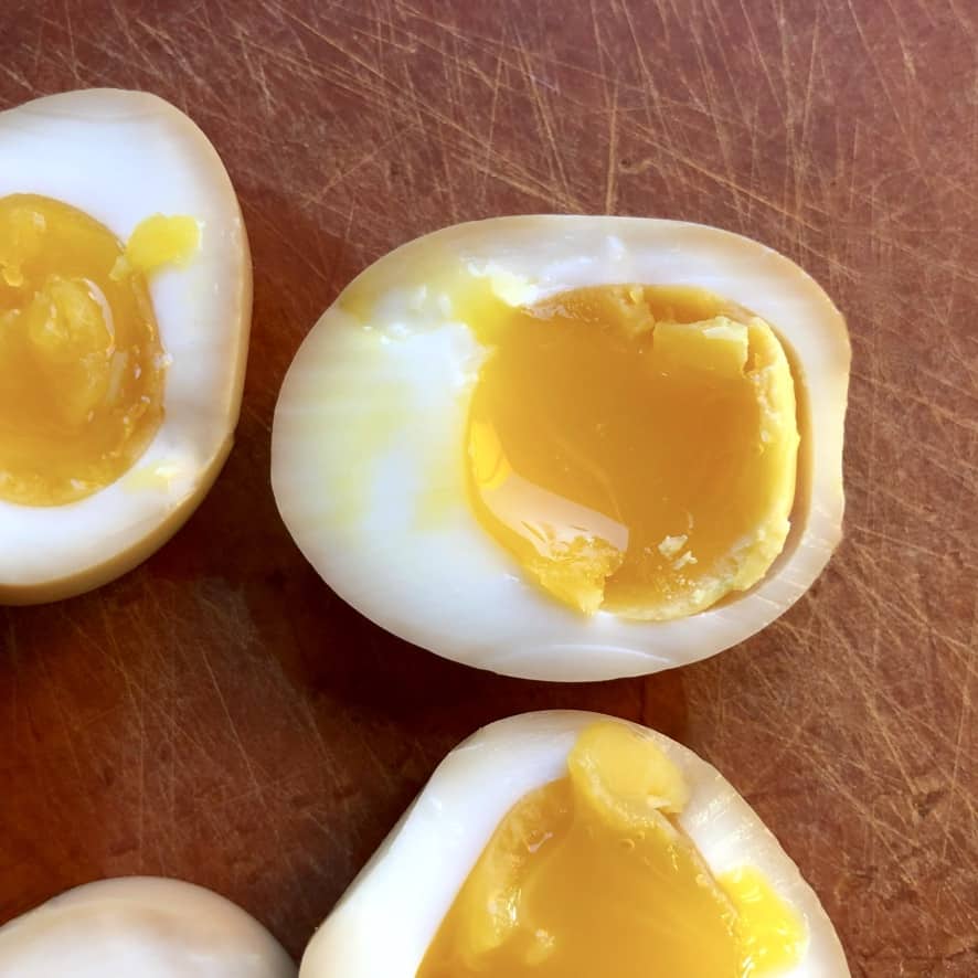 jammy soft boiled eggs cut in half