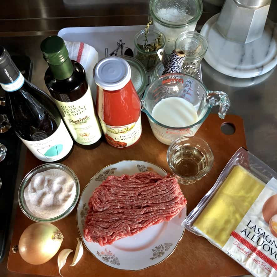 All the ingredients needed to make the tomato and white wine beef ragù plus fresh refrigerated lasagna egg sheets