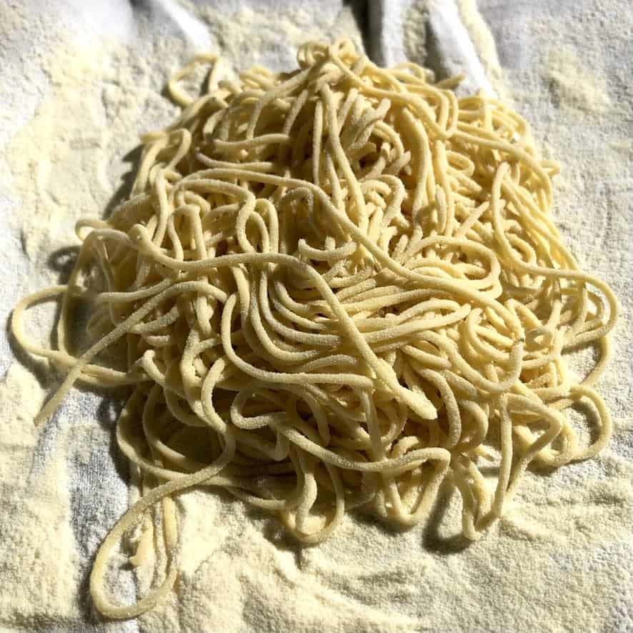 homemade ramen-sized egg noodles in a pile