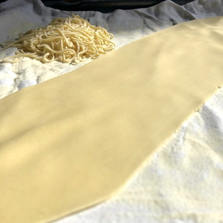 a smooth square of just rolled pasta dough that has been rolled on #6 and final setting (it's perfectly thin and very long)