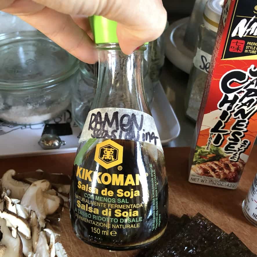 ramen shoyu tare mixed and added to an old washed low-sodium kikkoman soy sauce bottle with green pour spout (this is a great way to repurpose old bottles are make great tare holders because you can drizzle a small amount at a time if you want)