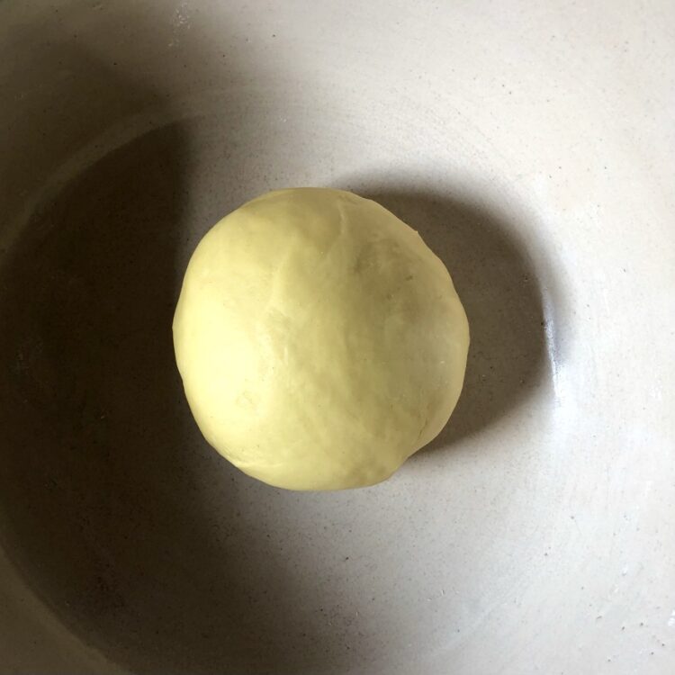 a beautifully, more intense yellow-colored fully rested egg pasta dough