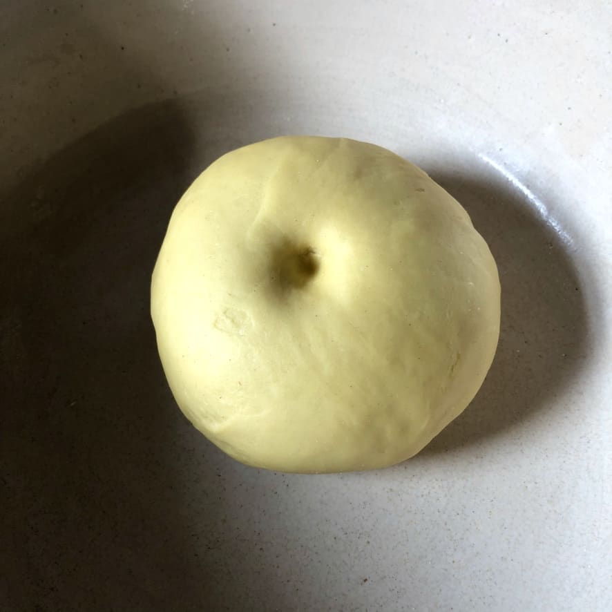 an indention that doesn't spring back shows the dough is ready to be rolled