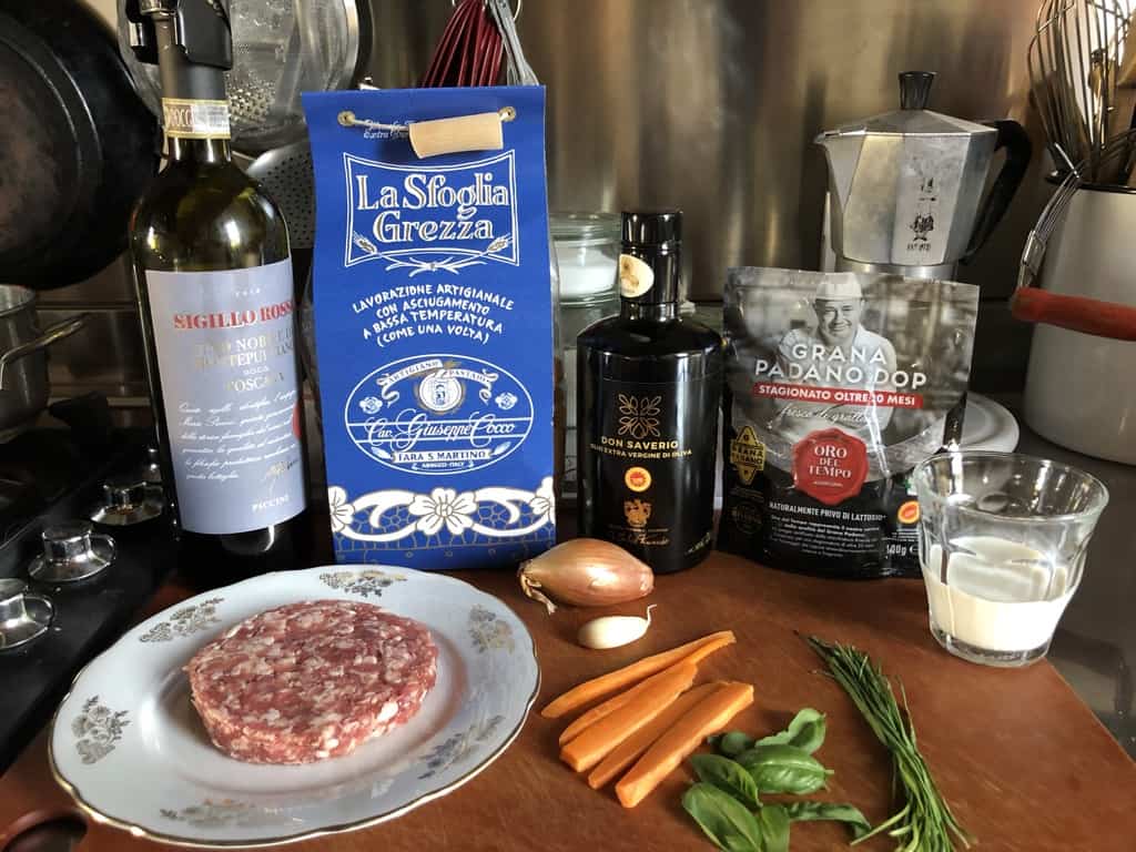 pasta alla norcina ingredients on a cutting board