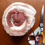 just rolled and tied pork belly next to some Littalia pop art kitchen shears