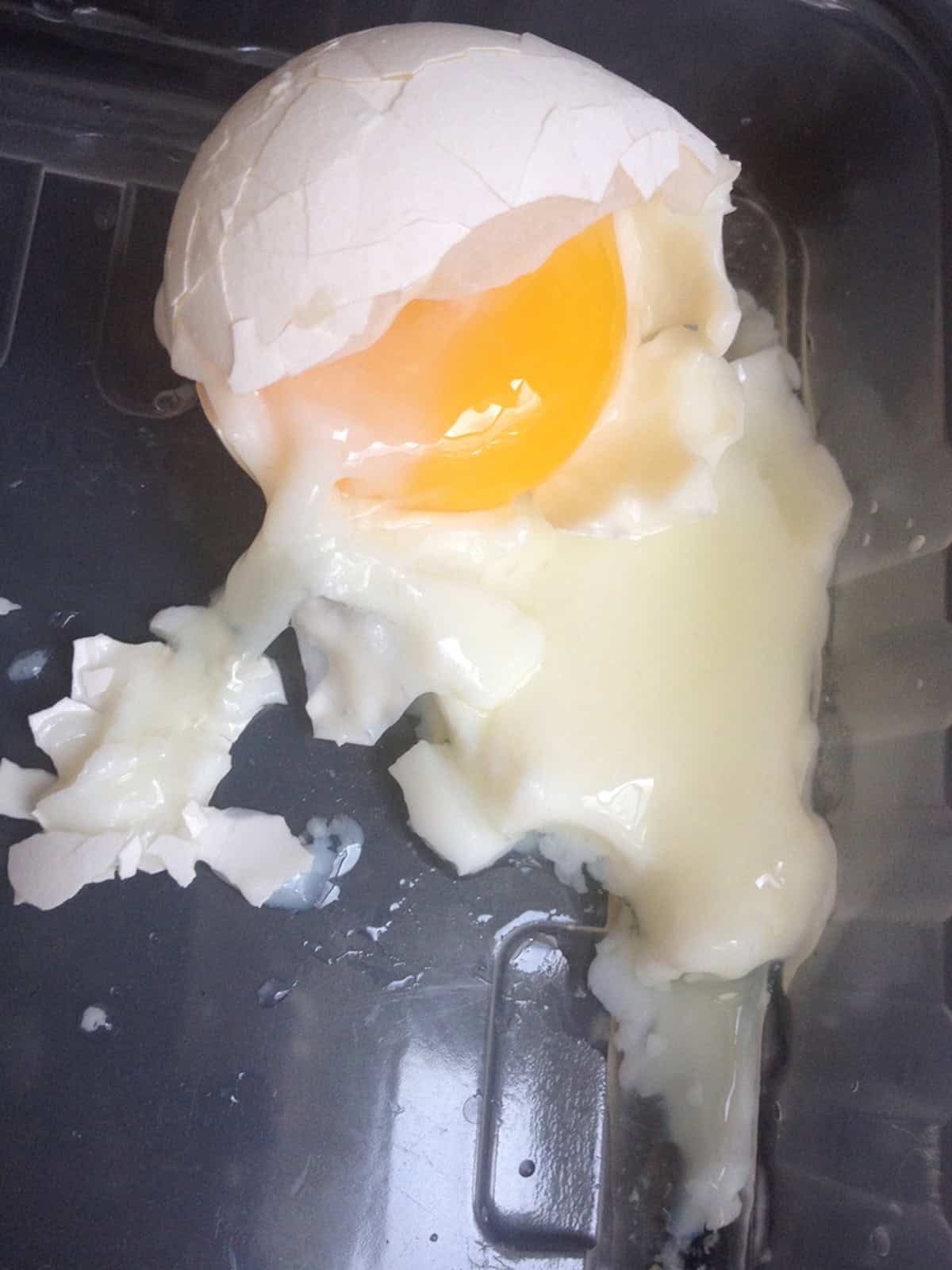A ramen egg recipe that is undercooked with part of the whites still clear and the egg falling apart - what not to do when making homemade ramen eggs. 
