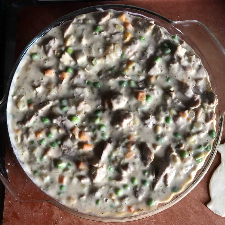 turkey pot pie filling added to the pie plate