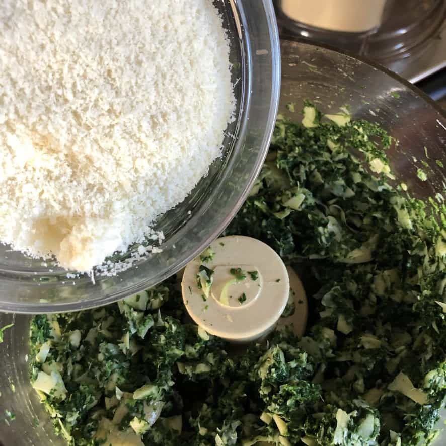 adding grated grana padano to the food processor