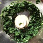 spinach and garlic clove chopped in food processor