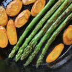 pan seared asparagus and pan seared carrots in a cast iron skilet