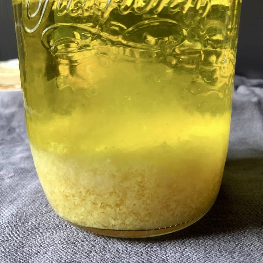 Alcohol and lemon zest & peels after steeping two days and the zest already looks milky and the liquid is bright yellow