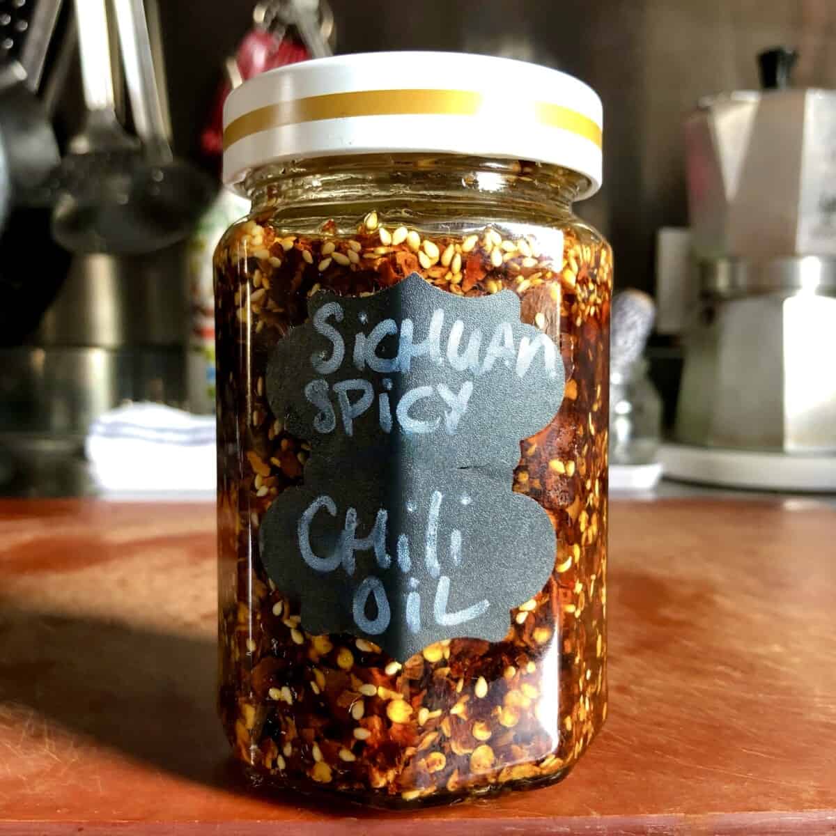 homemade Sichuan chili oil in a jar and labeled
