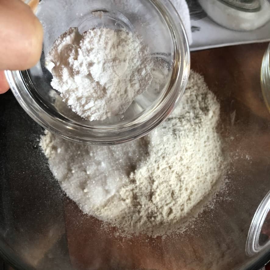 adding baking soda and baking powder to the flour mixture