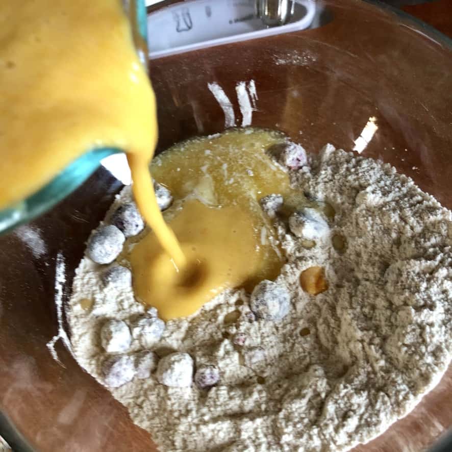 adding pumpkin mixture to flour mixture.