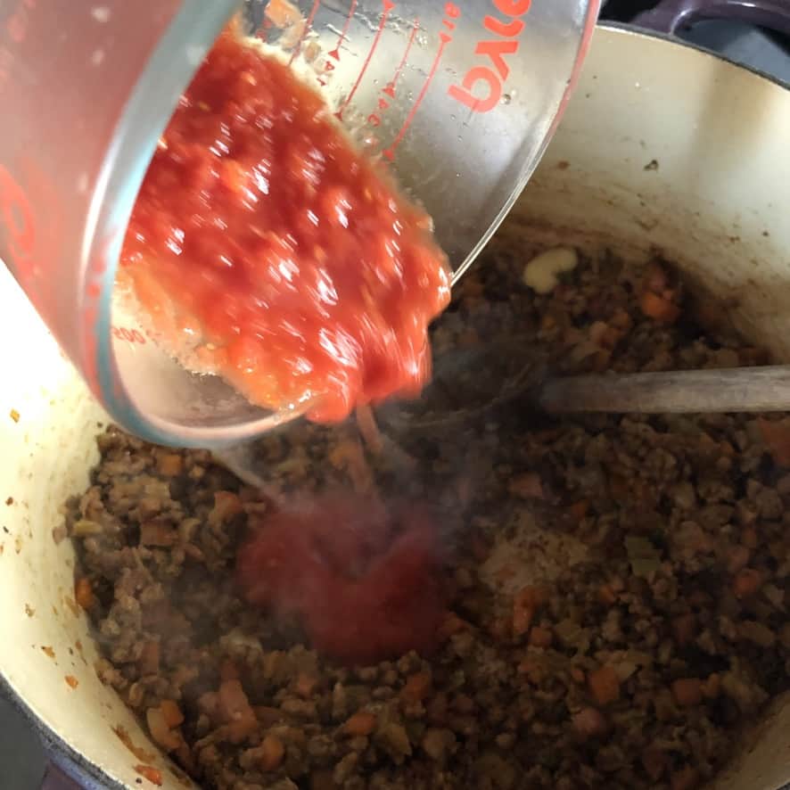tomatoes and tomato paste added the meat and veggie mixture