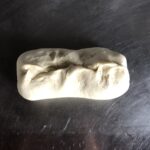 a log made out of the dough after it's been pinched together and shaped into a rectangle