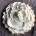 fluffy cloud-like meringue topping added to the coconut cream pie