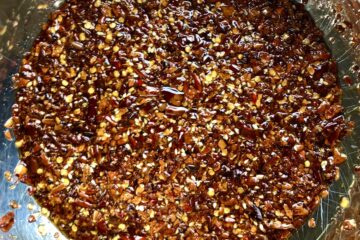 homemade Sichuan Chili oil with the last of the oil added.