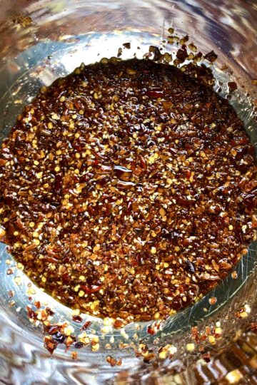 homemade Sichuan Chili oil with the last of the oil added.