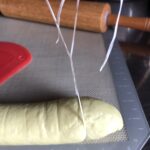 cutting the bao bun dough using dental floss for a clean cut