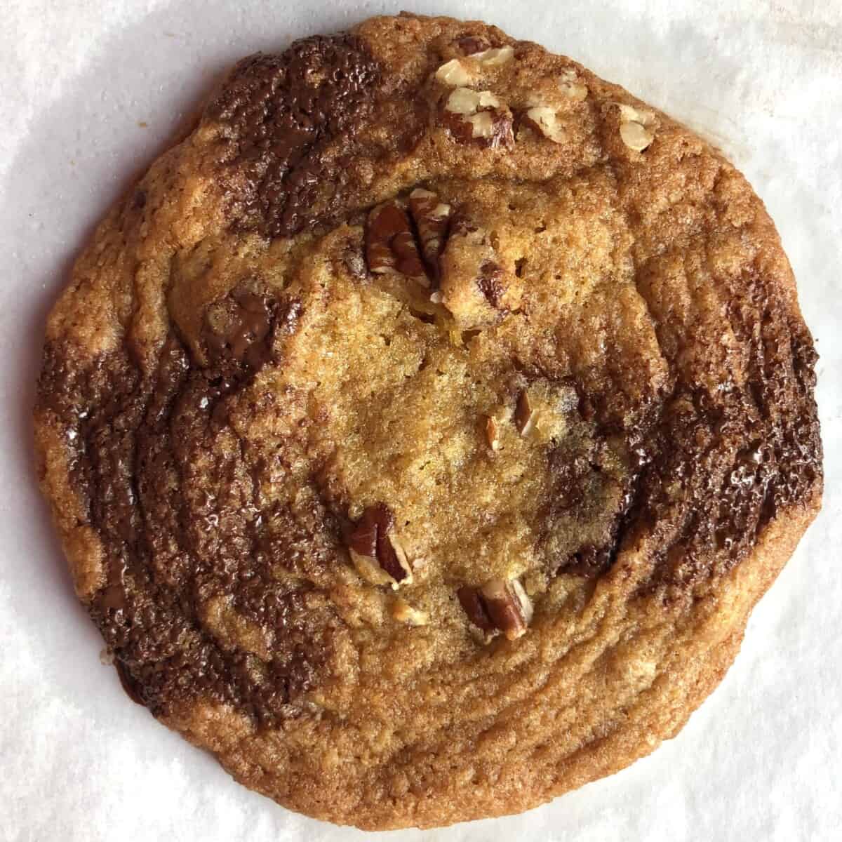 oversized cafe-style chocolate chip cookies with toasted pecans