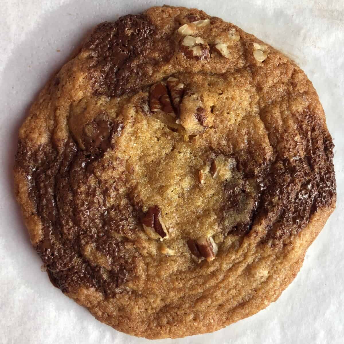chilled dough baked chocolate chip pecan cookie very soft and chewy, slightly wrinkled, with less spreading
