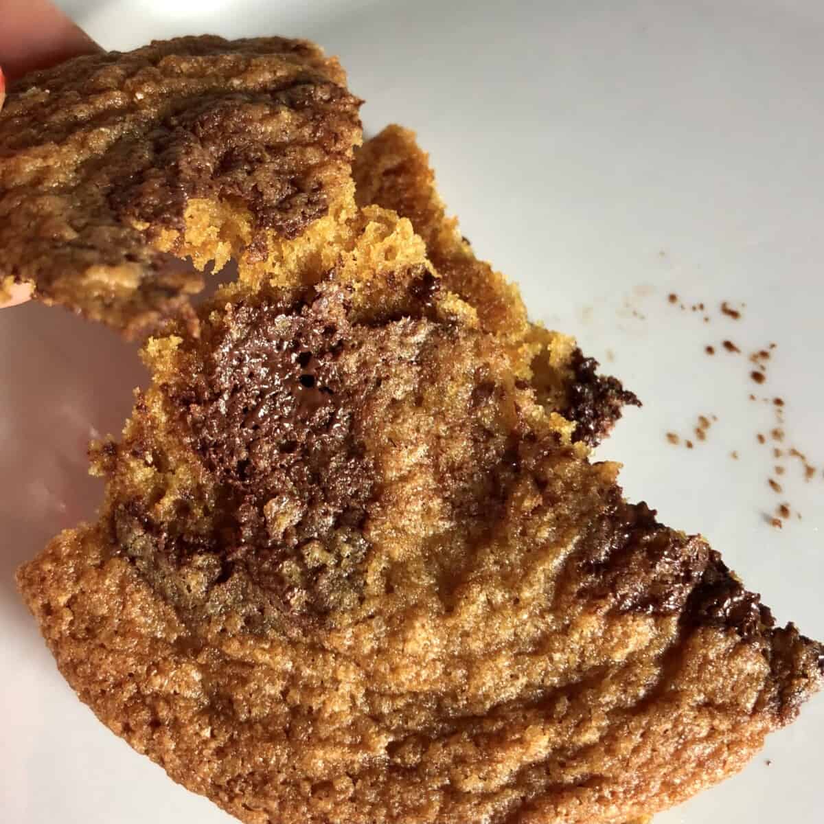cookie torn in half to show the middle and how soft it is