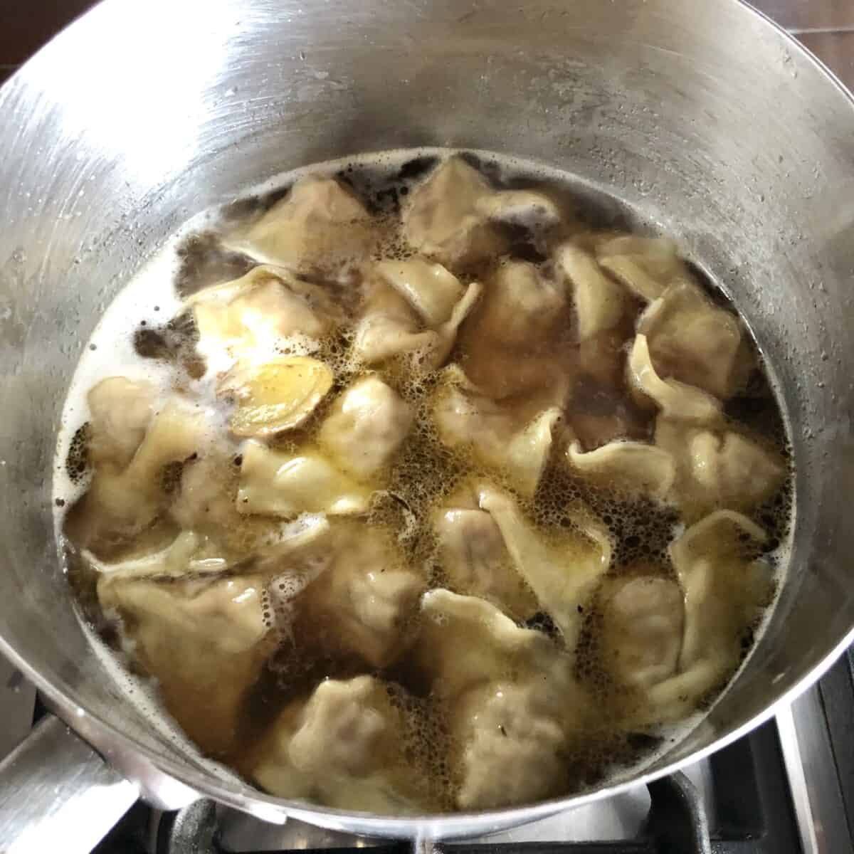 wontons floating on top and fully cooked