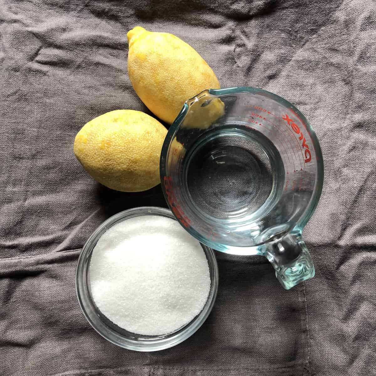 Homemade limoncello sugar made from leftover lemon peels after making limoncello, a zero-waste way to reuse limoncello ingredients for a lemon-flavored sugar.
