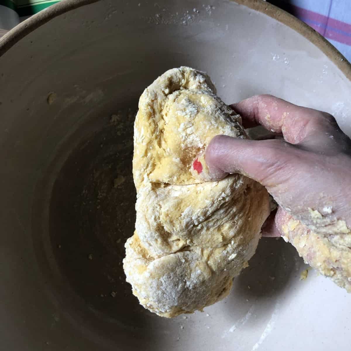 A shaggy semolina and 00 flour pasta dough ball just formed and ready to be further formed into a ball.