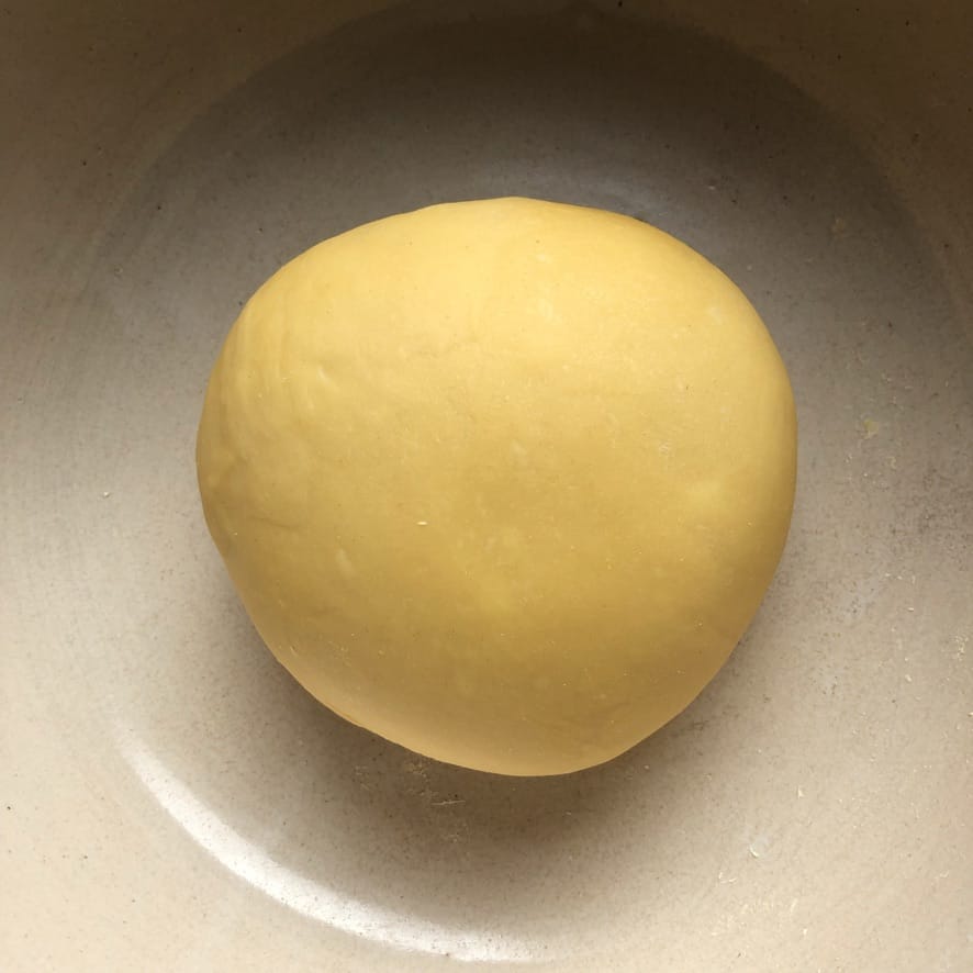 a well-kneaded but still semi-dry looking dough round (still needs to rest)